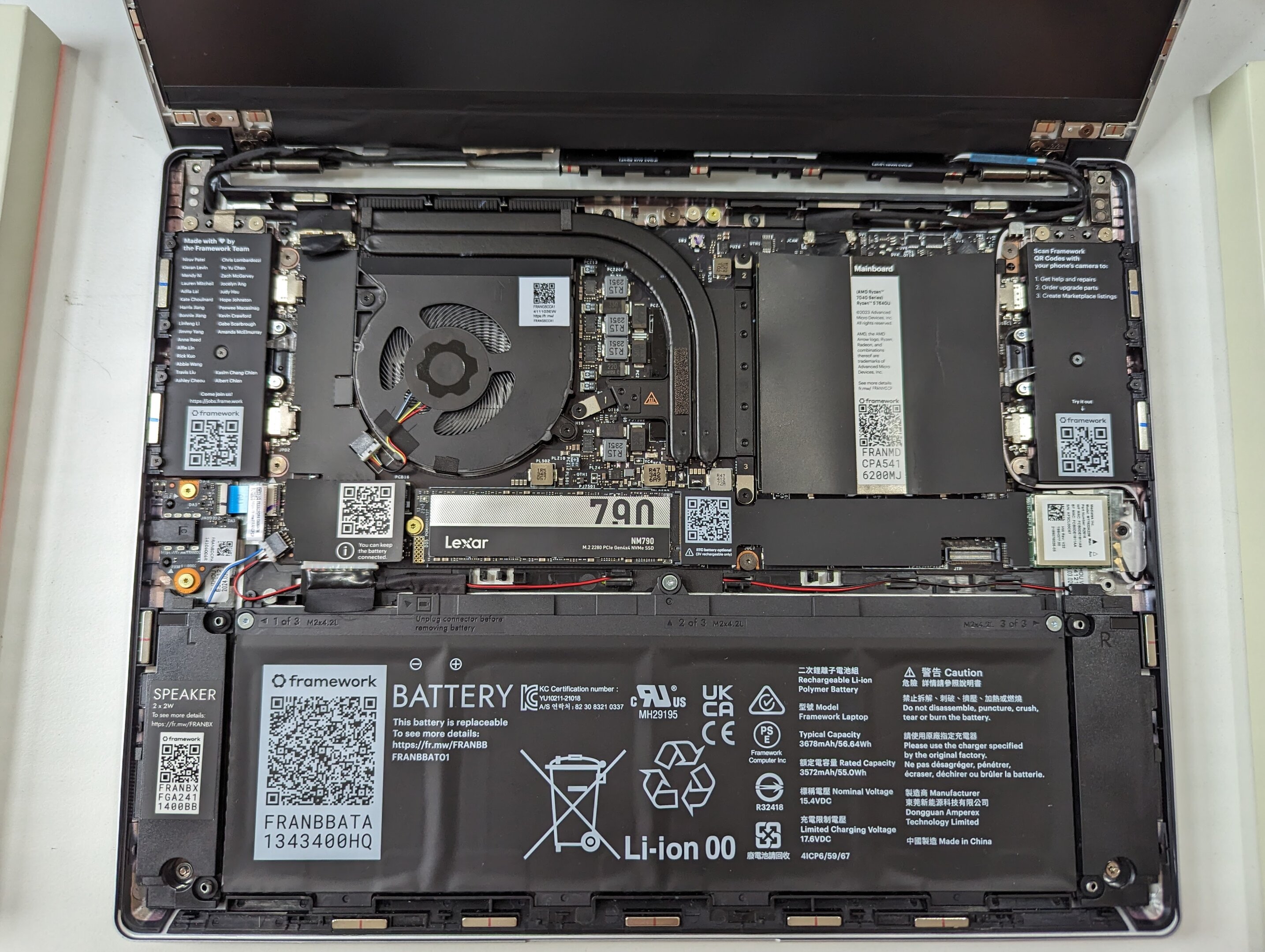 An open Framework Laptop 13 showing its internal motherboard and components