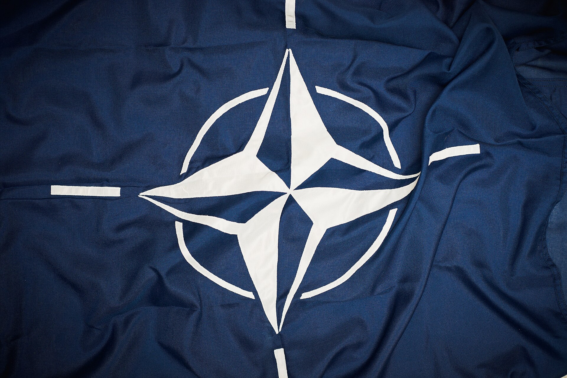 The NATO flag flying in front of NATO headquarters in Brussels