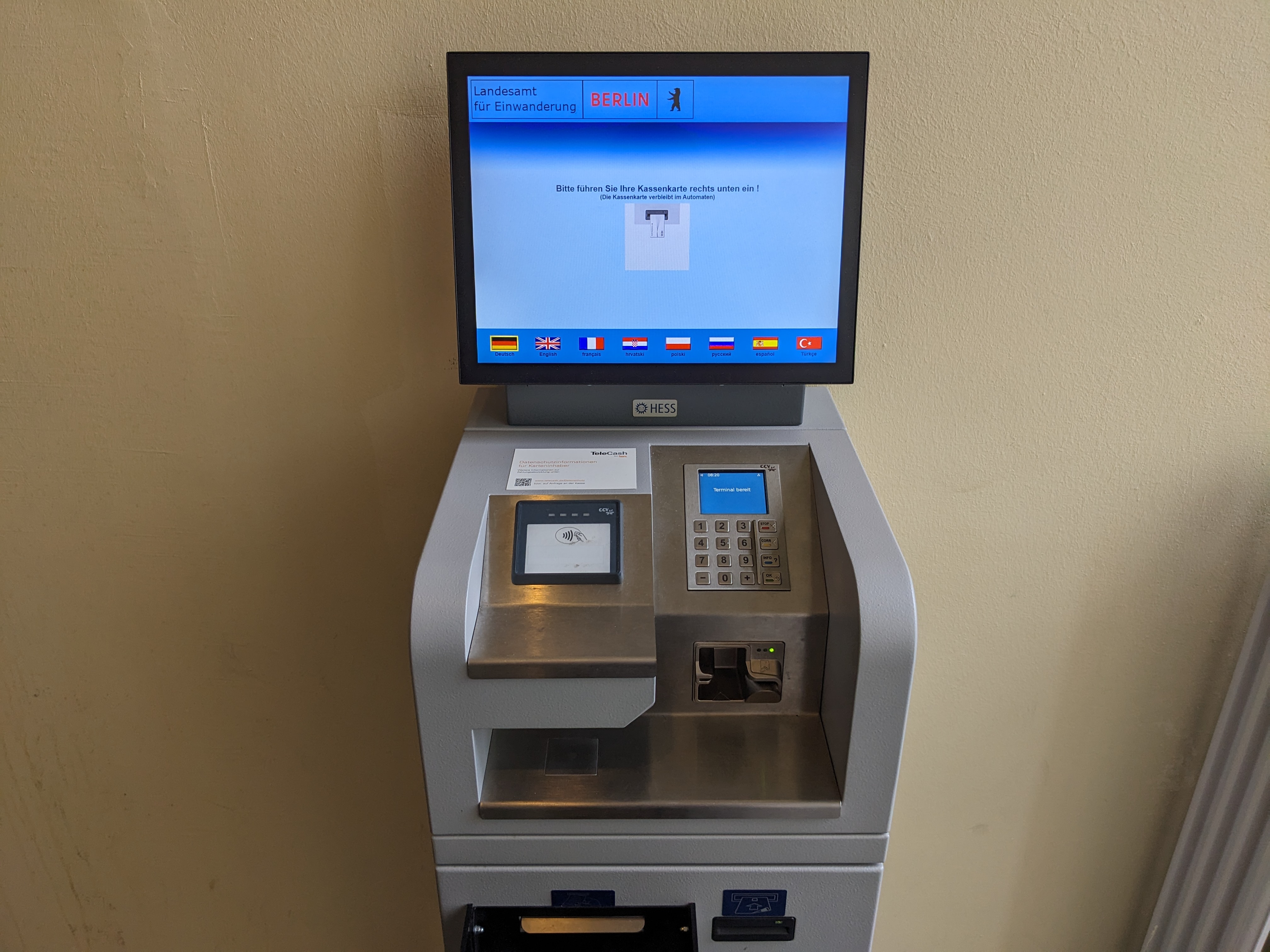 A card payment terminal at a checkout counter